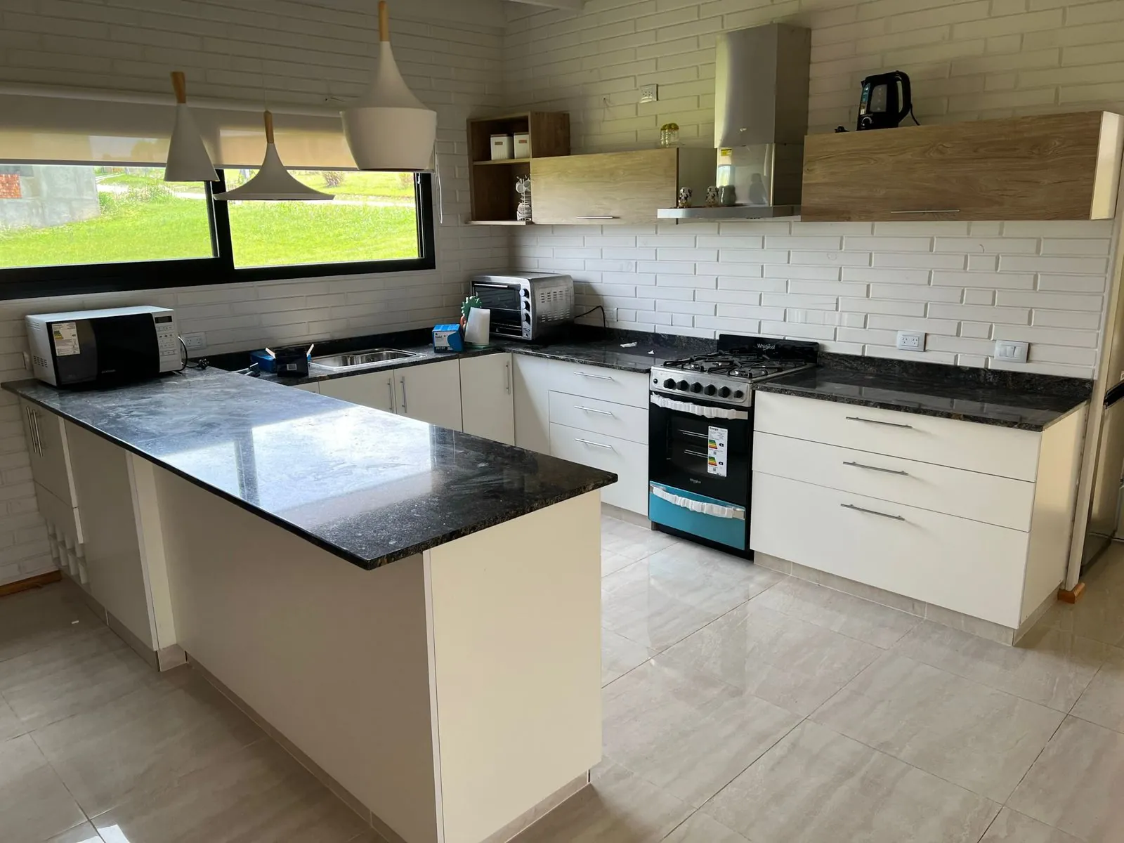 Modern kitchen with white wooden block walls
