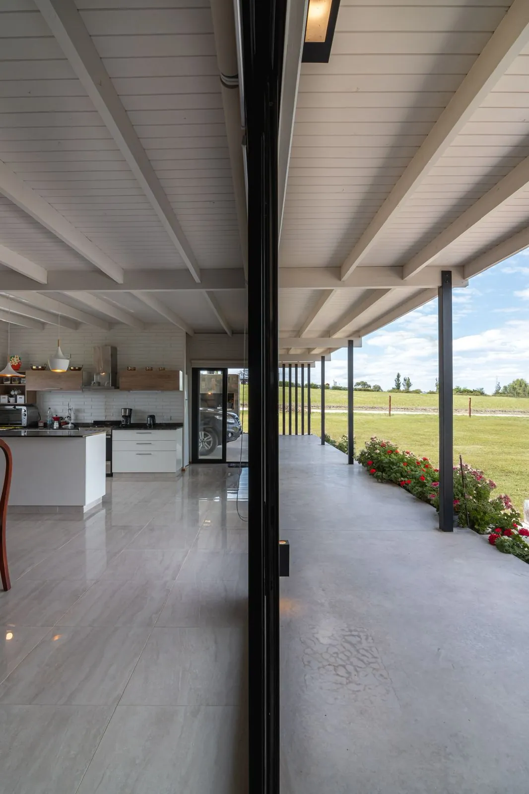 Kitchen and patio split by sliding glass doors