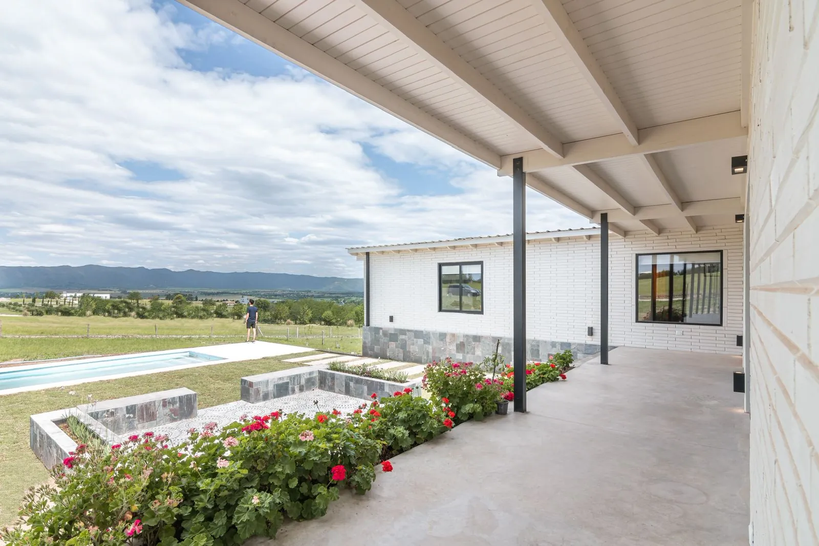 Covered patio of a wooden block home